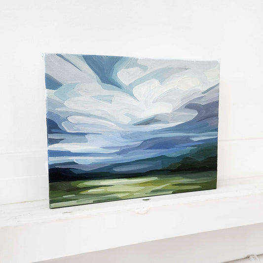Contemporary blue sky landscape painting with expressive clouds and peaceful movement