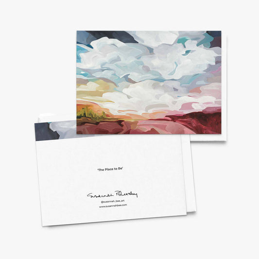 Blank greeting card featuring blue sky and rich red landscape painting