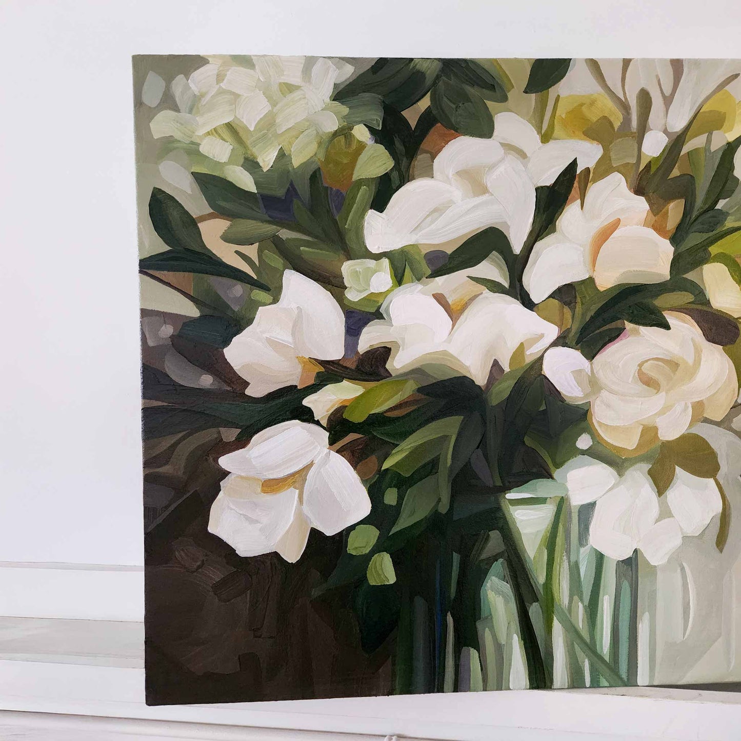 angled picture of a horizontal painting of creamy white flowers and green foliage