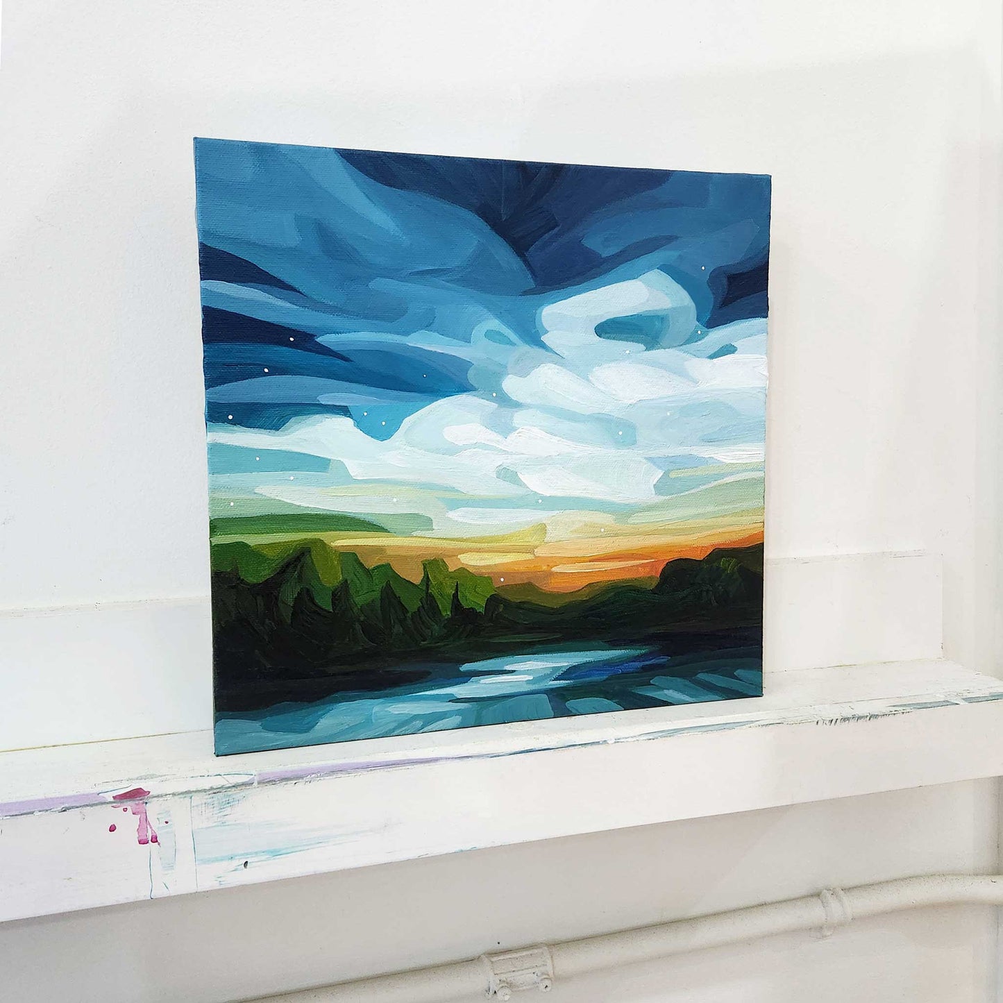 lakeside sundown painting in studio