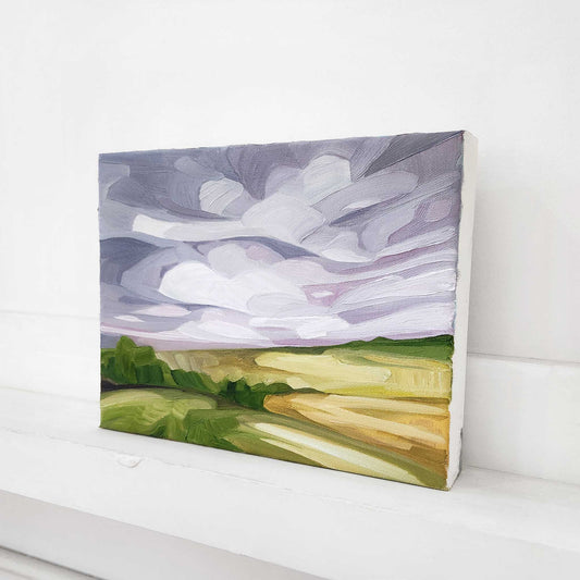 Abstract countryside oil painting with a soft mauve sky and textured brushwork.