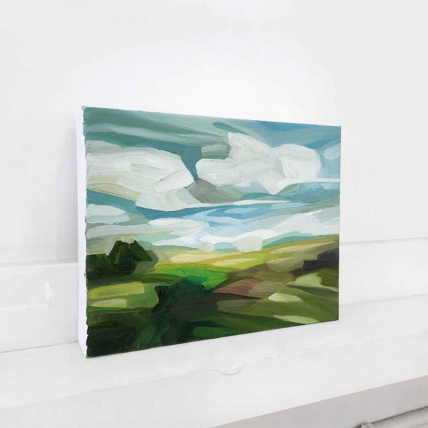Original landscape painting of a sunny countryside under expansive blue skies.