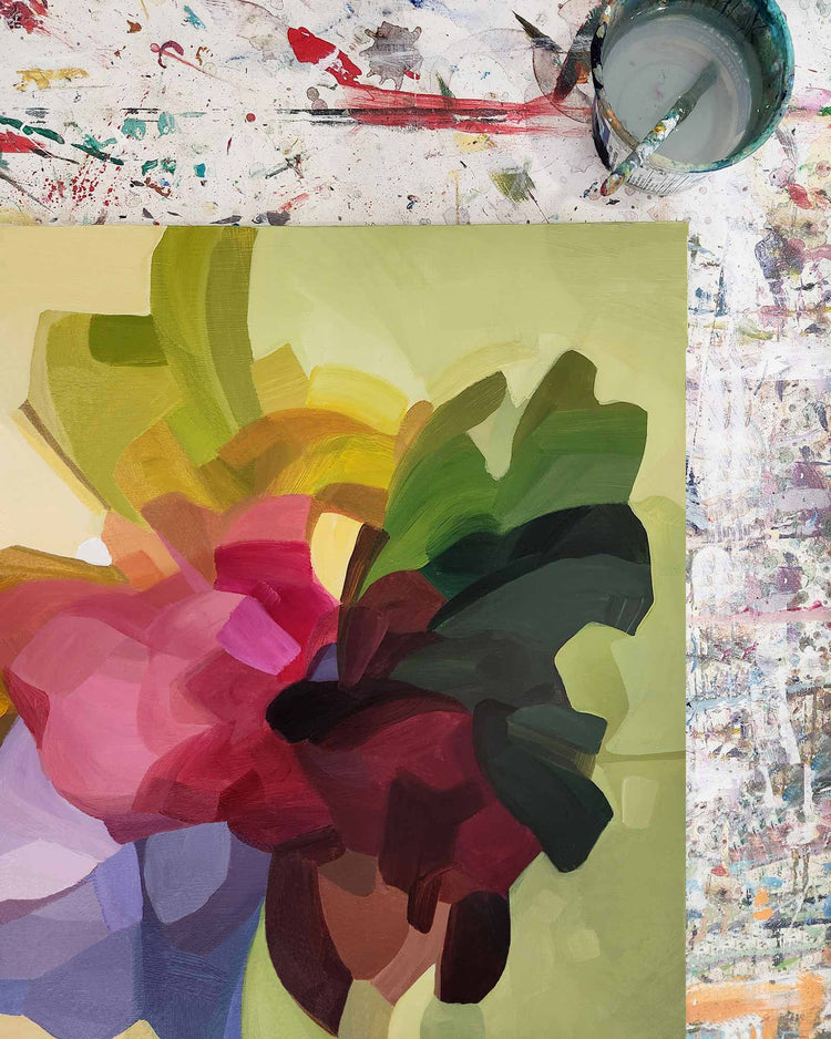 green yellow abstract painting on artist's table