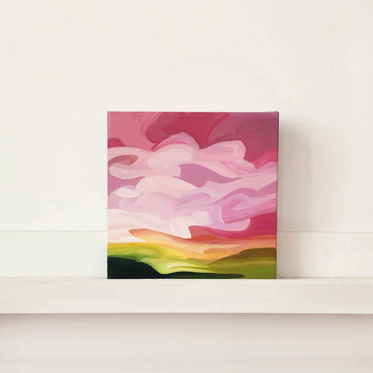abstract landscape painting wikth a bright pink and orange sunset sky