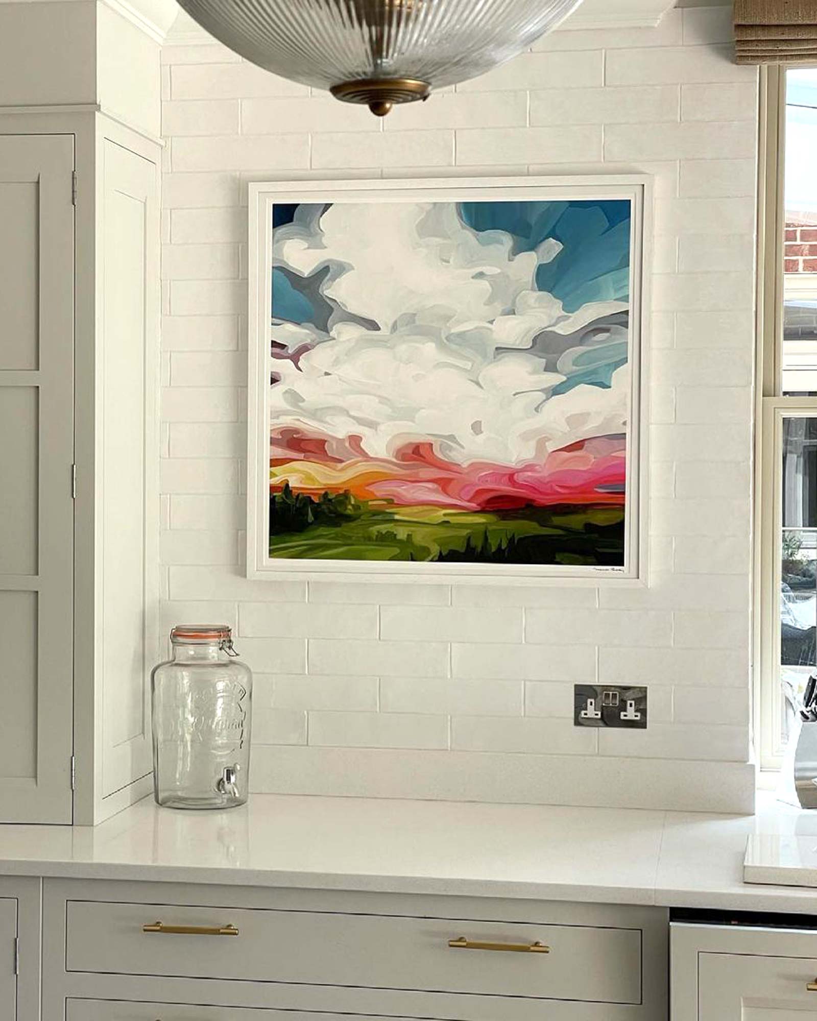 acrylic sky painting abstract skies art print hanging in a white kitchen