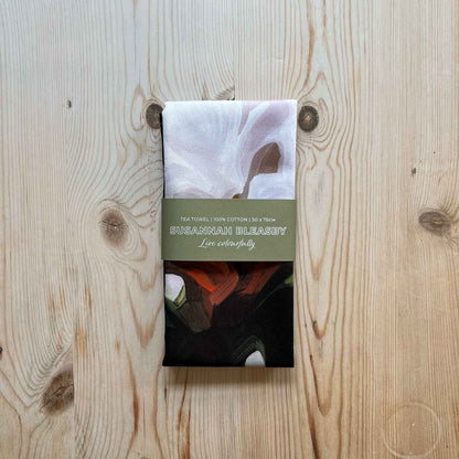 folded beige cotton tea towel