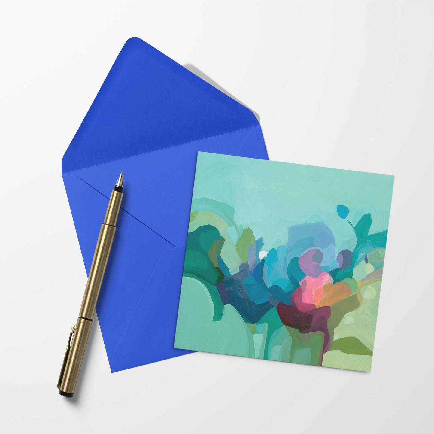 blank art card wiht mint green abstract artwork and blue envelope