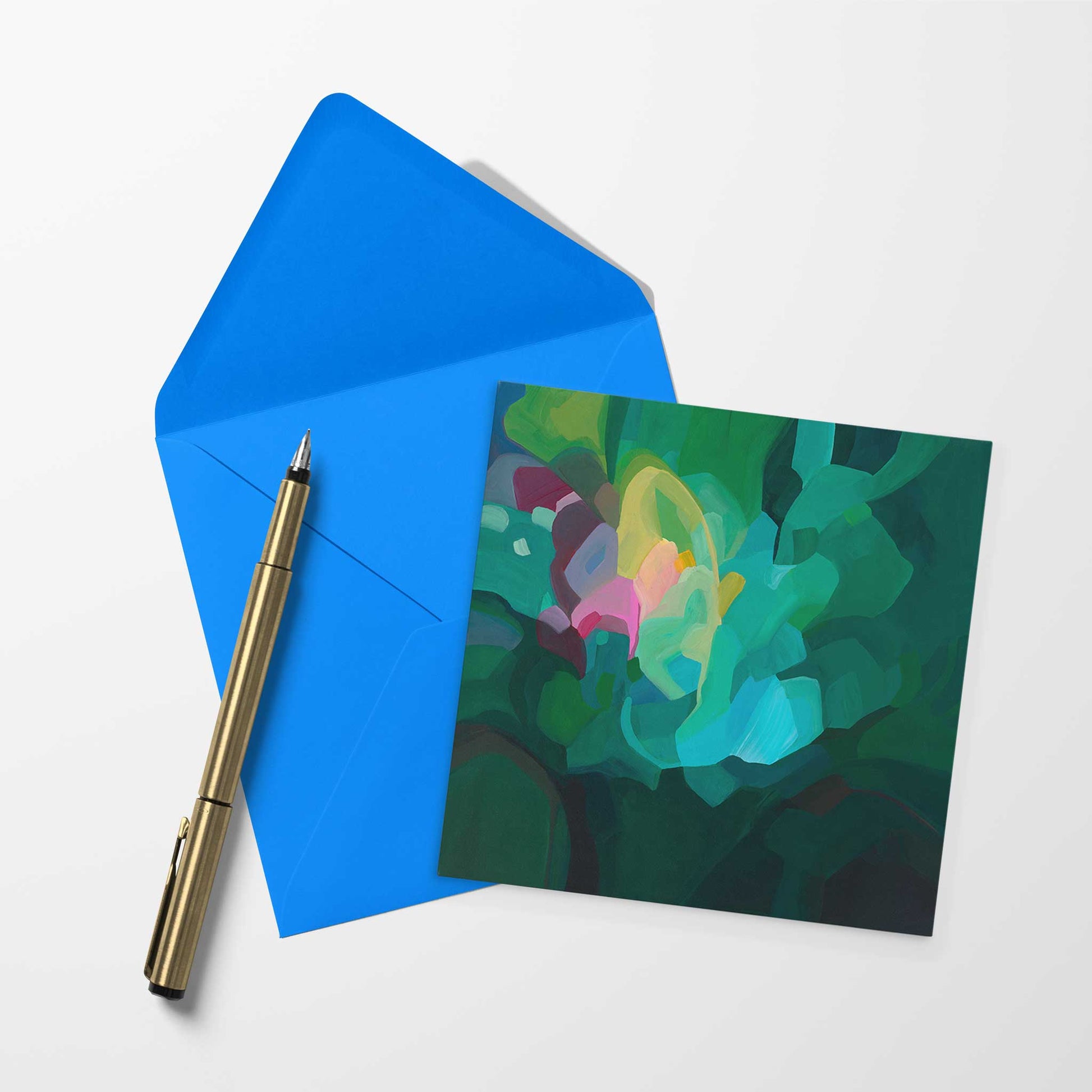 Blank art card with emerald abtract artwork and bright blue envelope