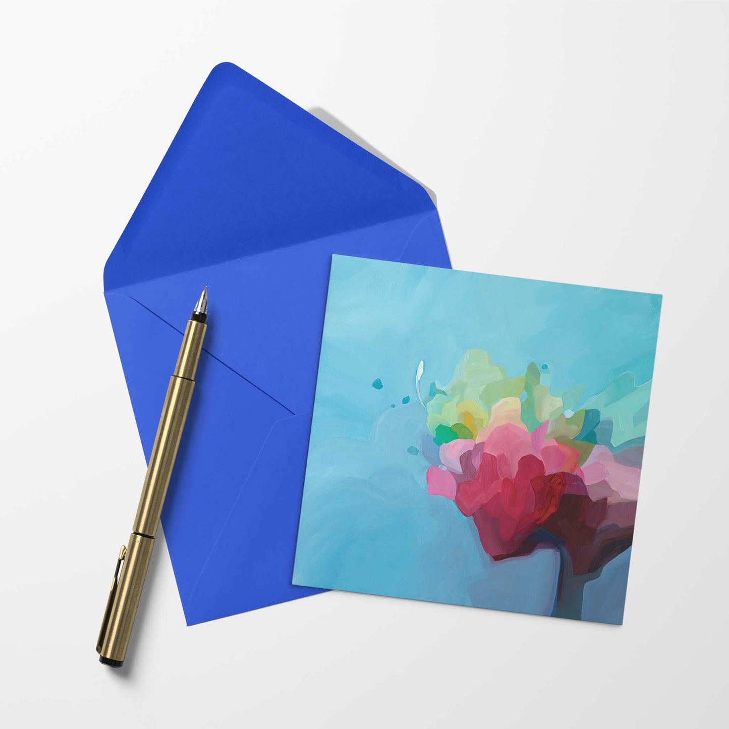 blank greeting card with blue abstract artwork and matching envelope