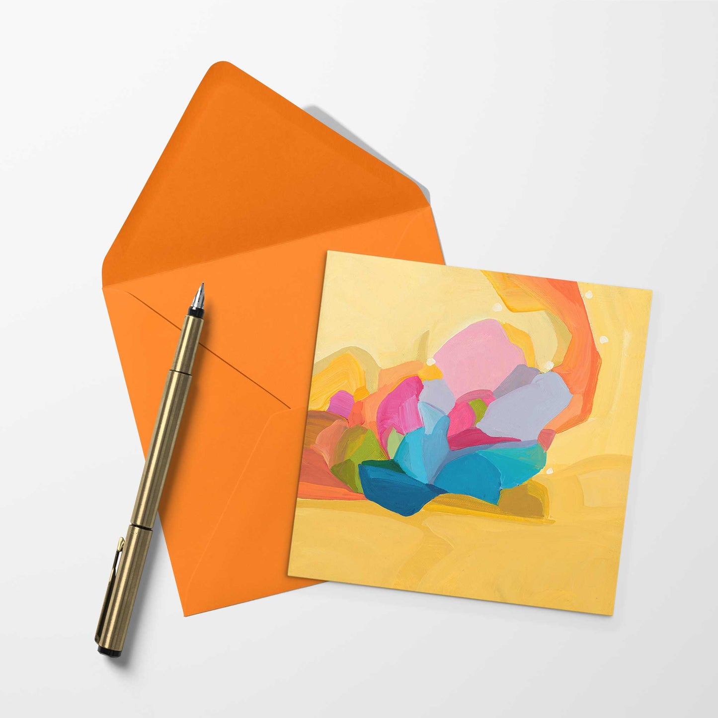 blank art card with yellow abstract design and orange envelope