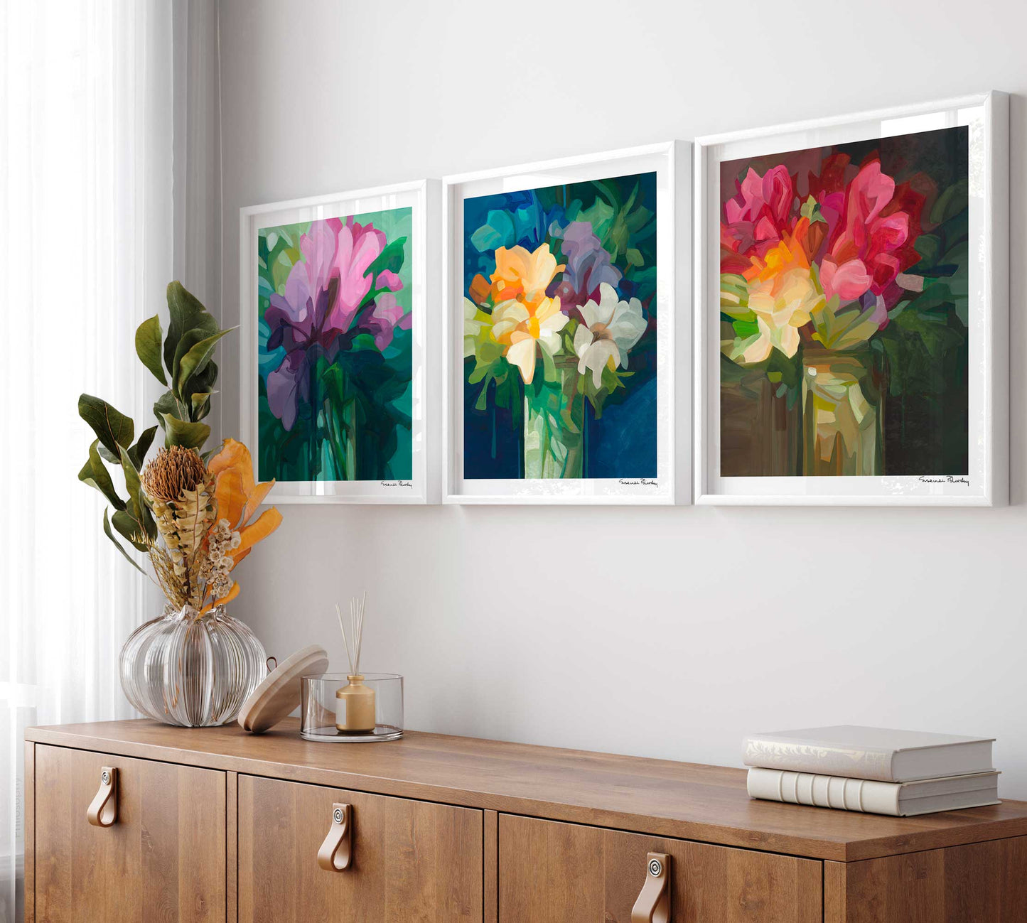 three framed abstract floral wall art prints in living room