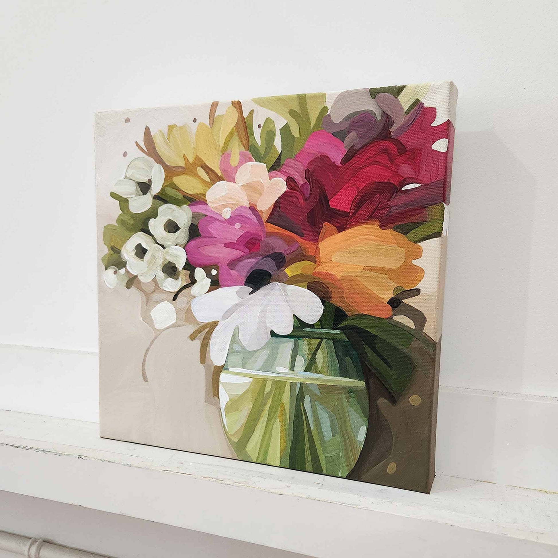 Modern floral artwork with warm palette of cream, pink, orange and red