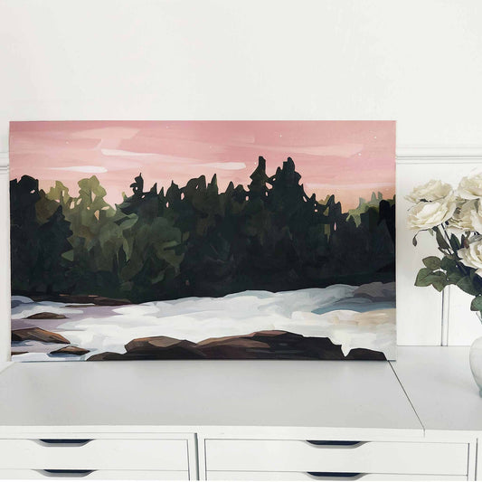 An acrylic forest painting depicting a snowy forest under a pink sky, creating a contrast between the cold and the warm