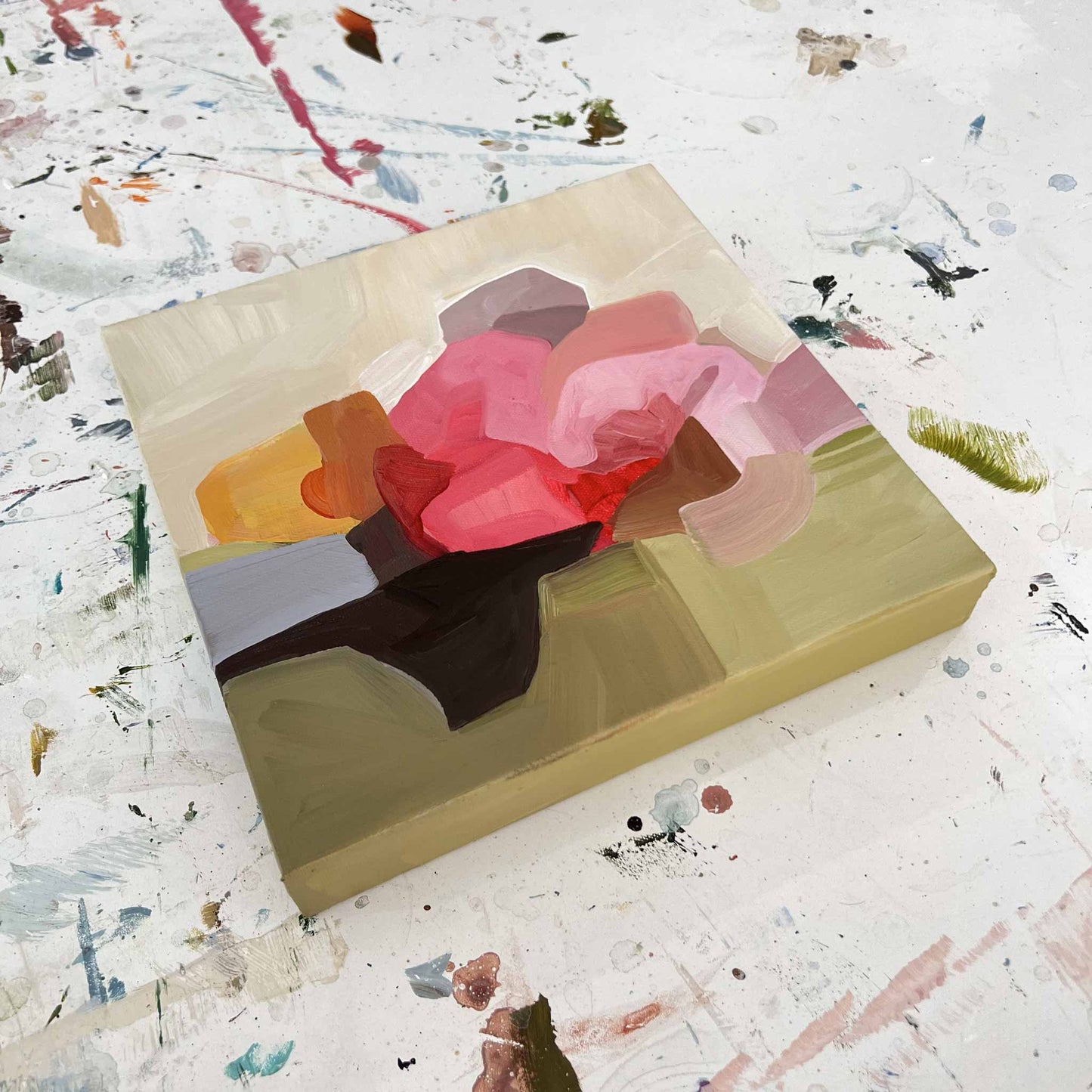 side view of a small abstract painting with a modern floral design by Canadian artist Susannah Bleasby