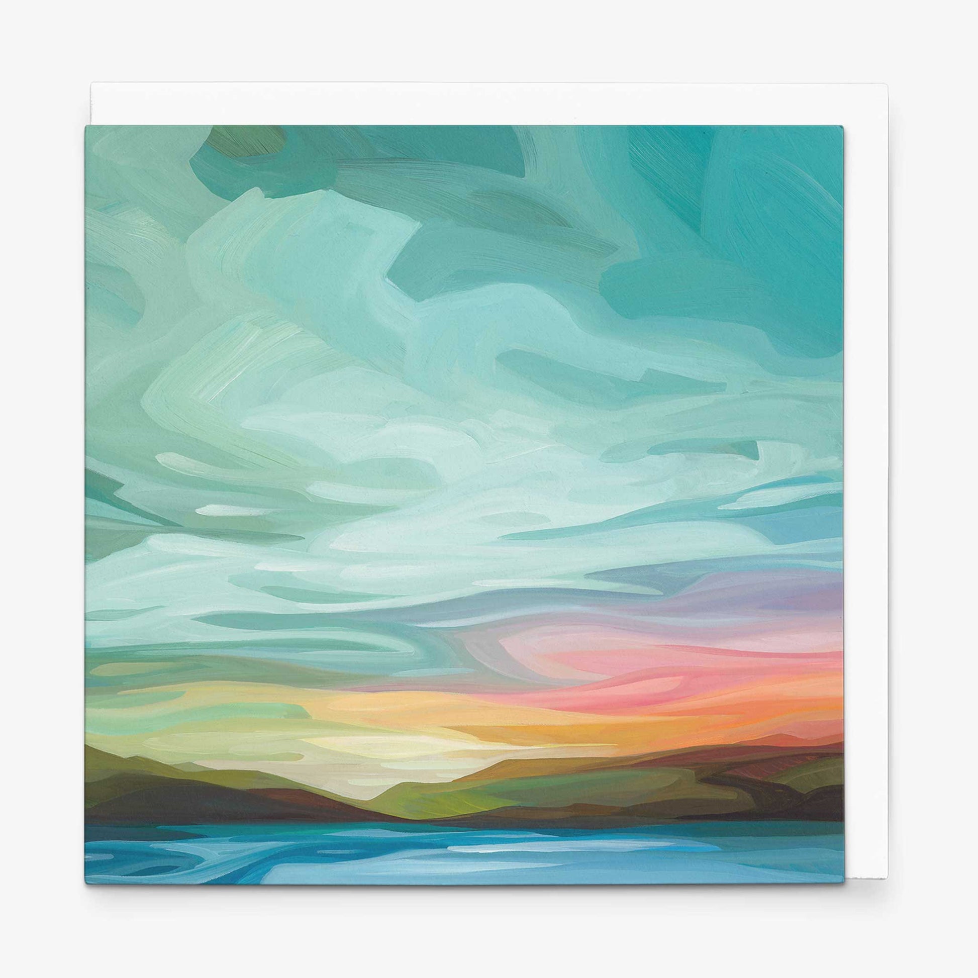 Abstract sky greeting card featuring turquoise clouds and warm sunset colours over an open horizon