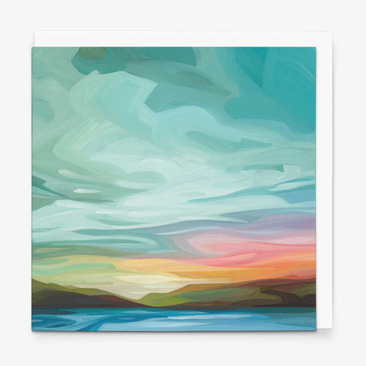 Abstract sky greeting card featuring turquoise clouds and warm sunset colours over an open horizon