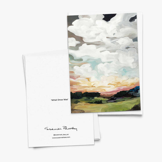 Blank greeting card with soft autumn landscape and warm sky
