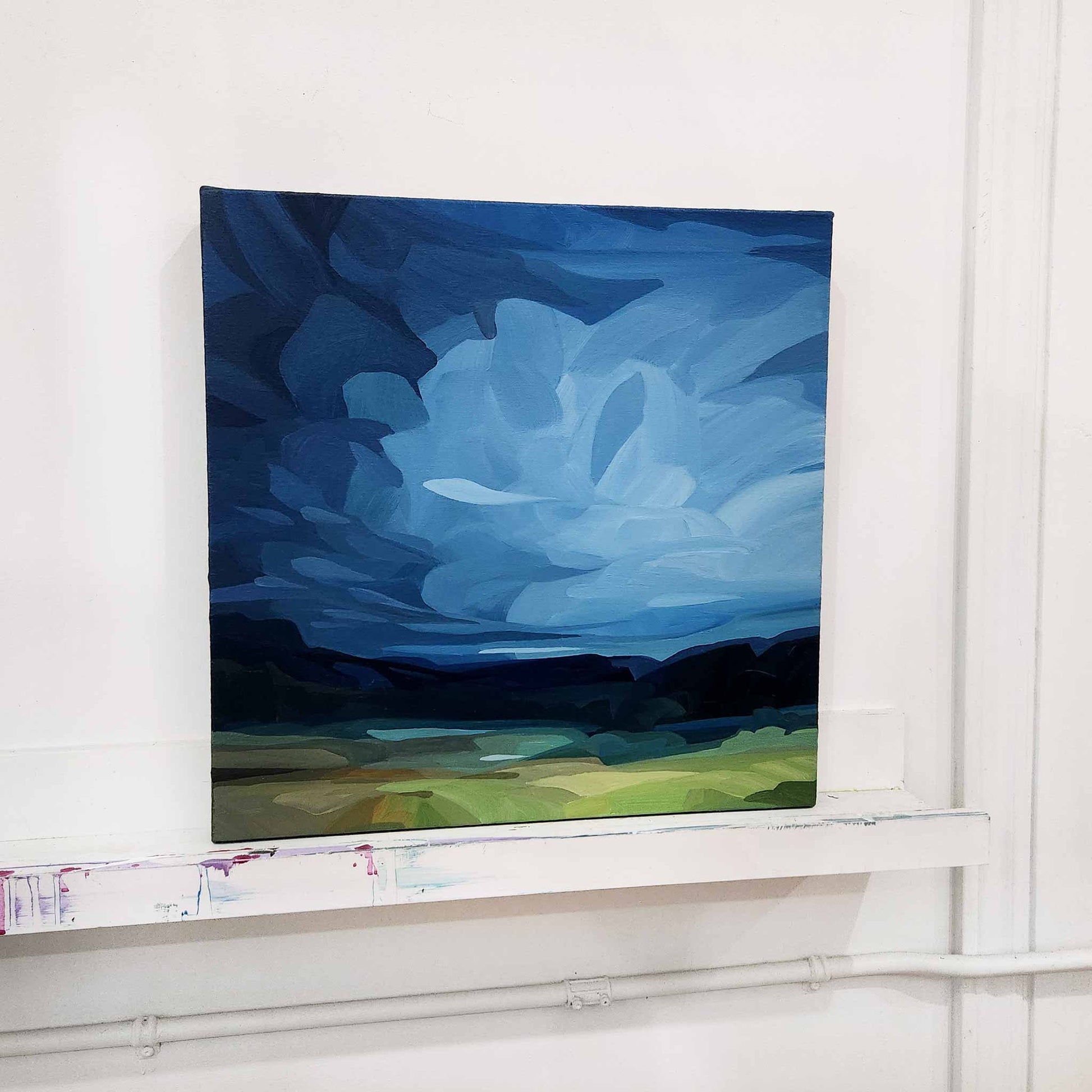 blue abstract sky painting in studio