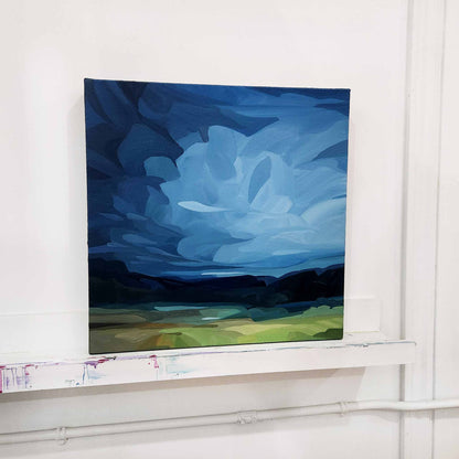 blue abstract sky painting in studio