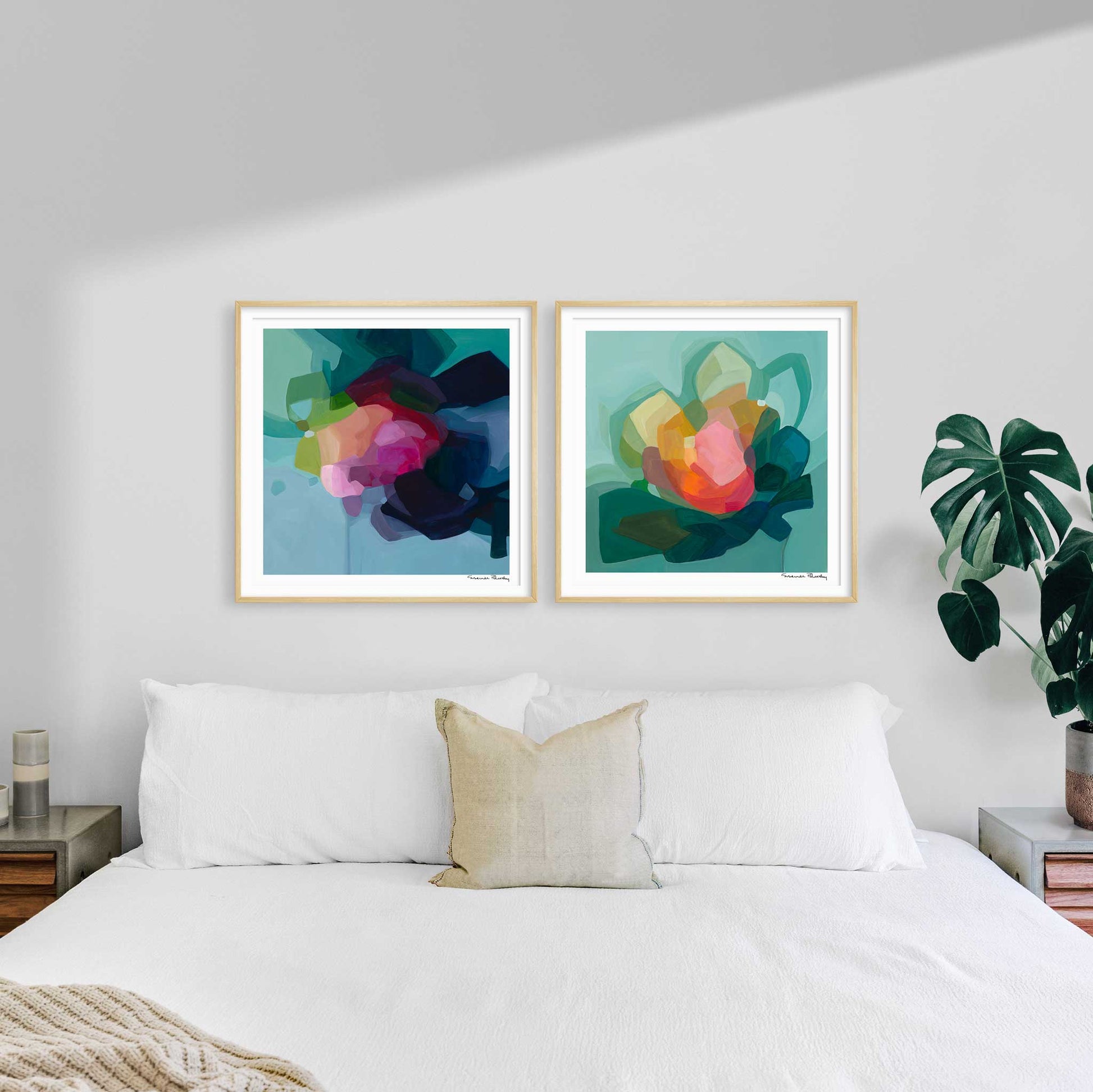 blue and teal abstract art prints in bedroom