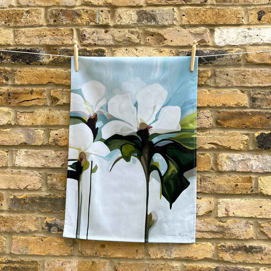 blue and white floral cotton tea towel with abstract white flowers and soft sky blue design