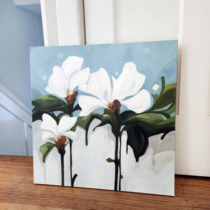 white floral painting on light blue canvas