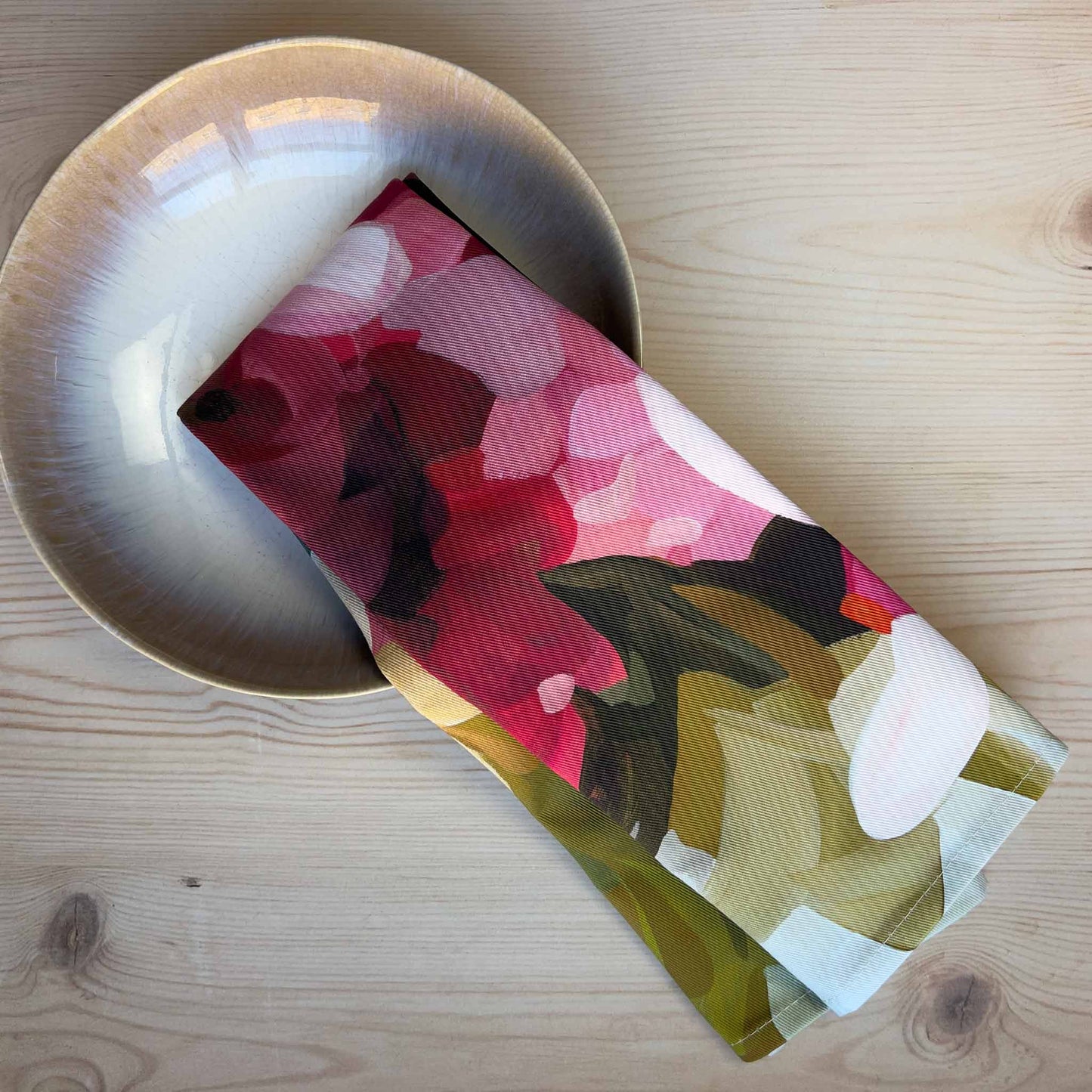 bright floral british made tea towel styled in a bowl