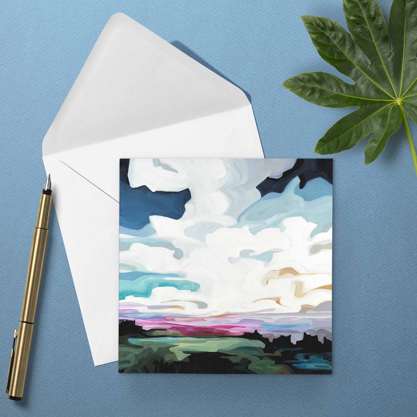 Colourful sunset greeting card with cobalt blue skies, glowing magenta horizon, and dreamy evening atmosphere