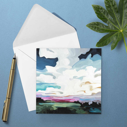 Colourful sunset greeting card with cobalt blue skies, glowing magenta horizon, and dreamy evening atmosphere