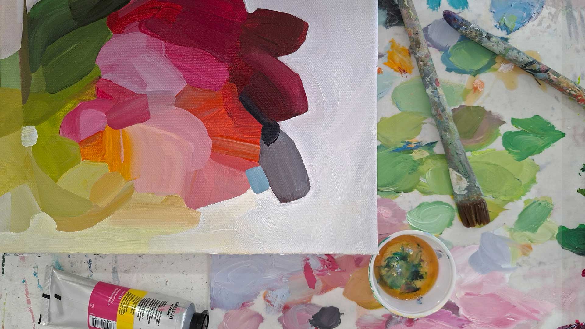 colourful abstract oil painting on artist table
