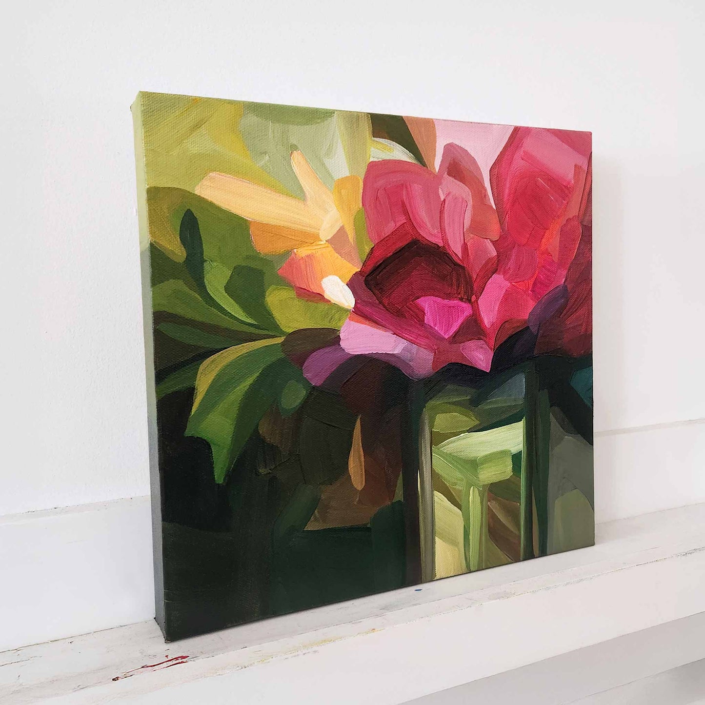 contemporary abstract flower painting with magenta blooms and green leaves
