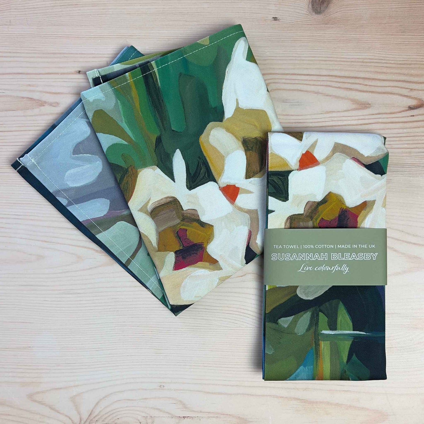 cotton floral tea towels with abstract blooms and green foliage
