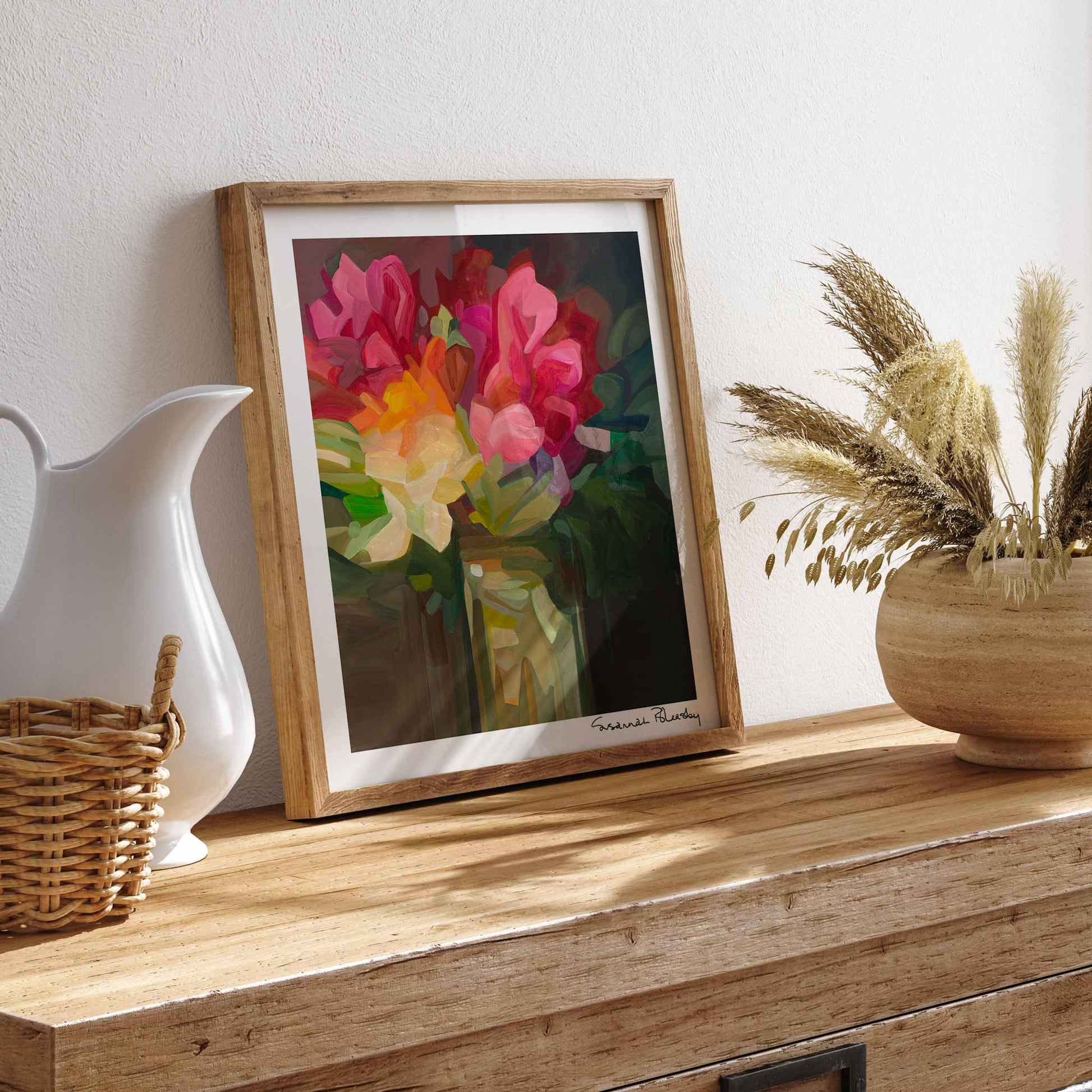 framed abstract floral artwork on sideboard
