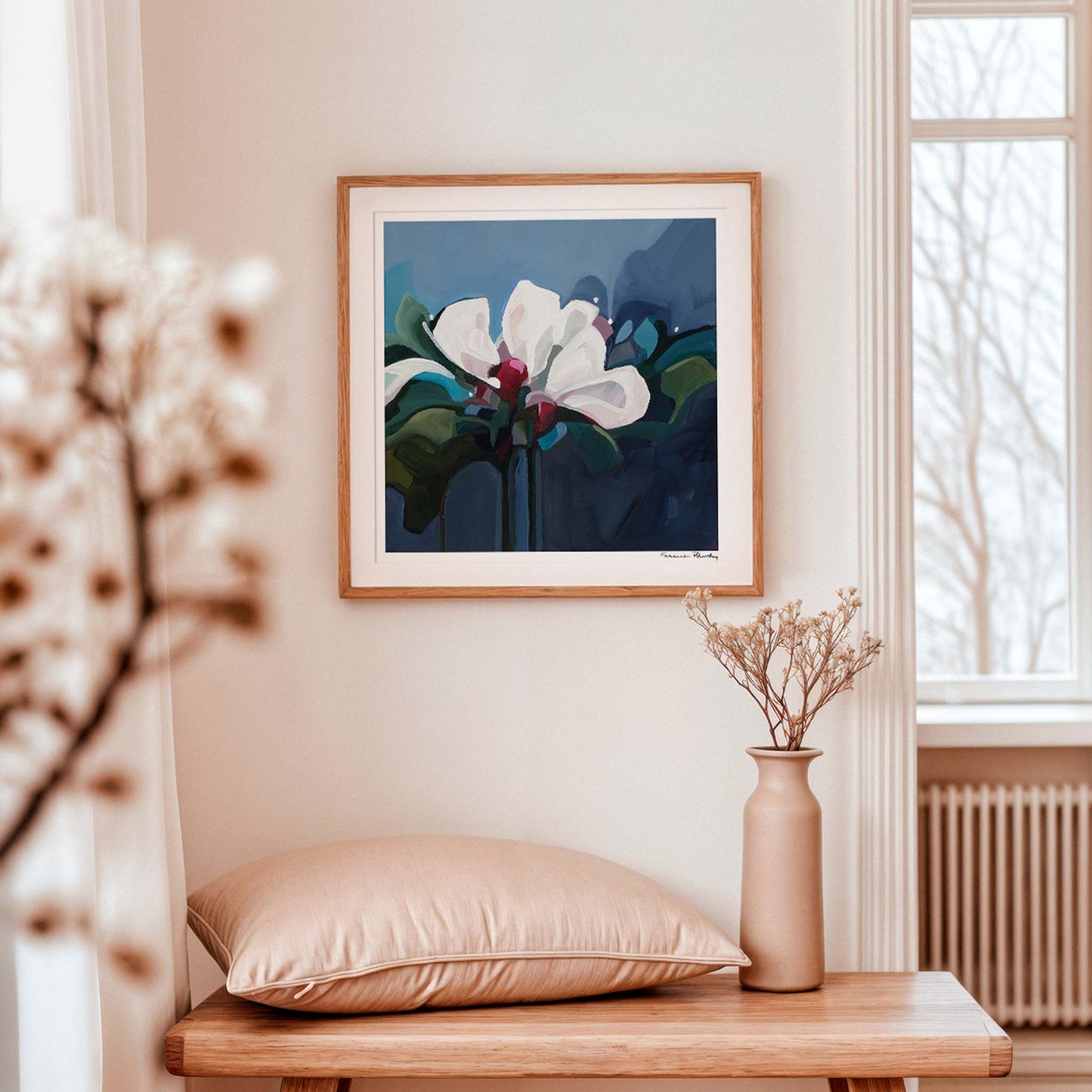 Dark blue floral art print by Susannah Bleasby displayed as statement wall art in a modern interior