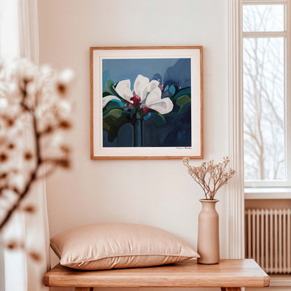 Dark blue floral art print by Susannah Bleasby displayed as statement wall art in a modern interior
