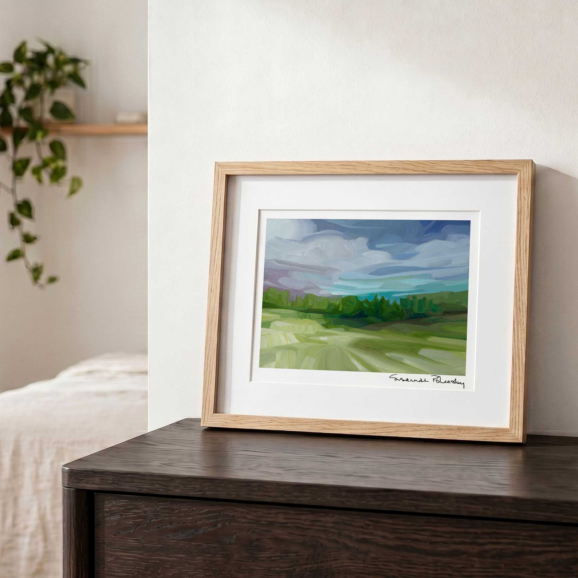 Contemporary landscape wall art featuring a colourful sunset sky and peaceful tree-lined countryside