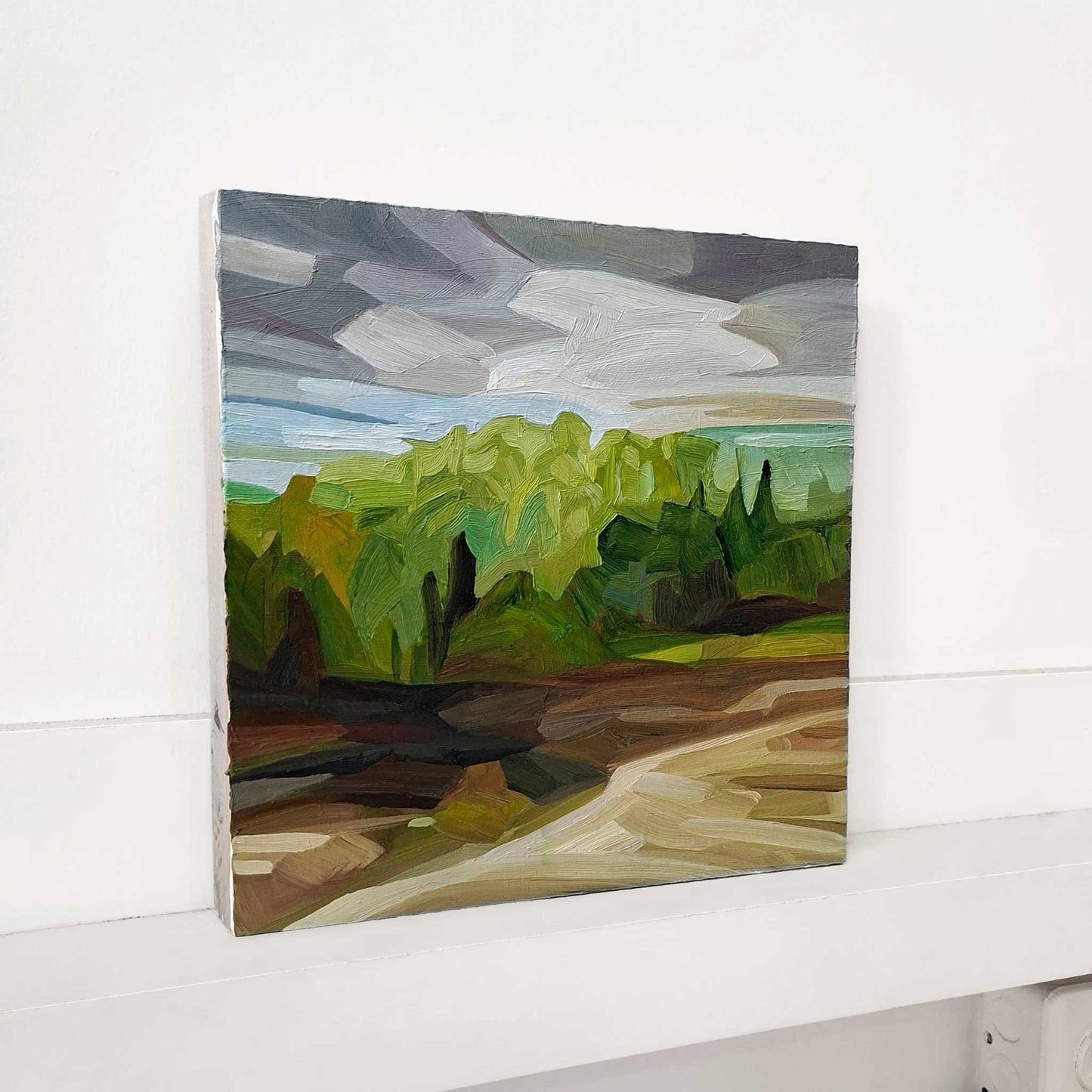 original oil painting on panel of a spring forest landscape with brown fields and a grey mauve sky