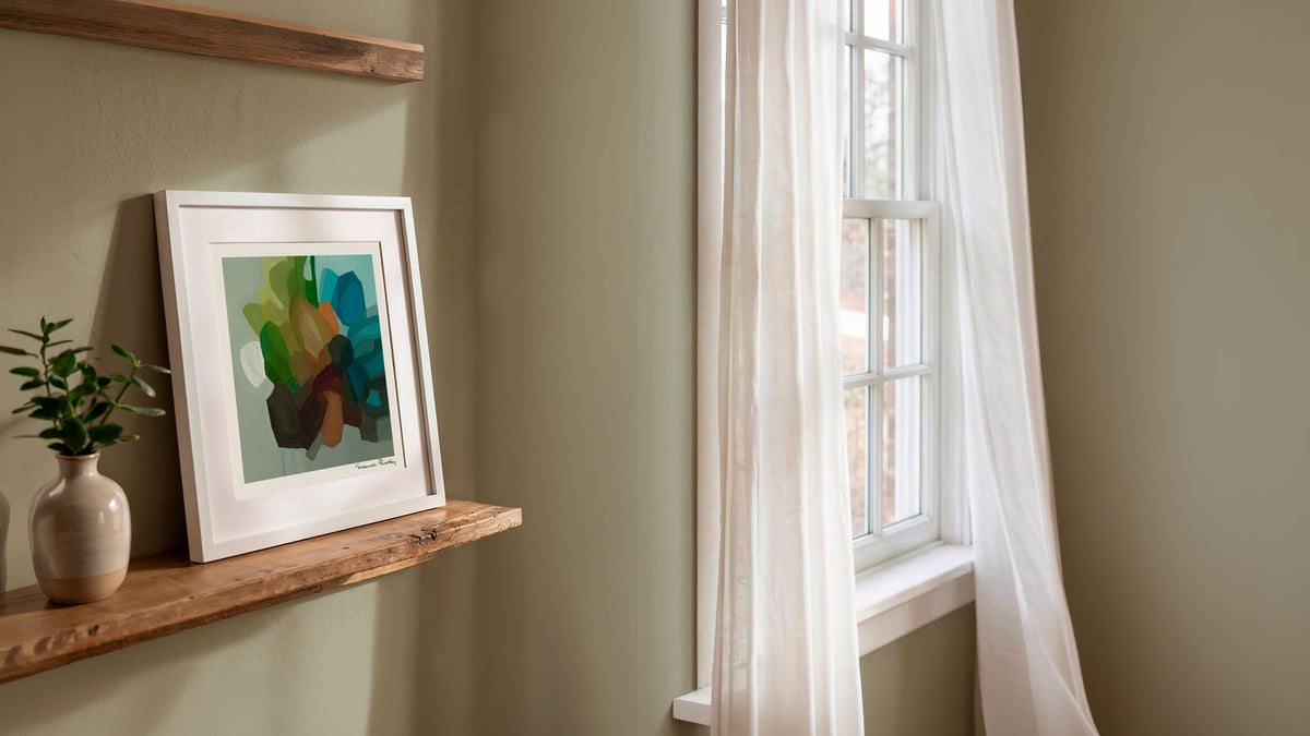 green blue abstract art print on shelf