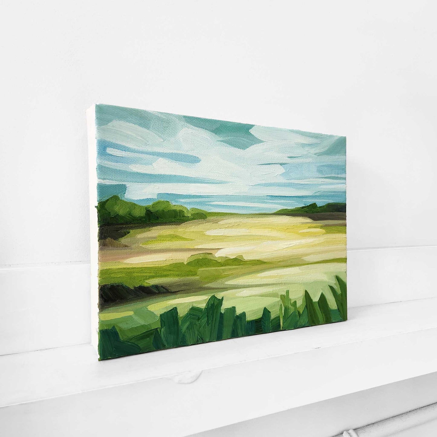 Colourful oil painting of rolling green fields in the summer sunshine.