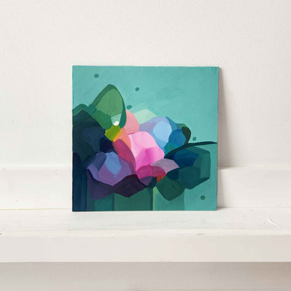 modern art of abstract pink flowers on teal canvas