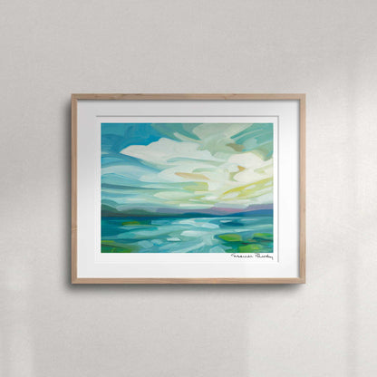 Lake and sky landscape fine art print featuring billowing clouds, beams of light and colourful spring reflections on the water