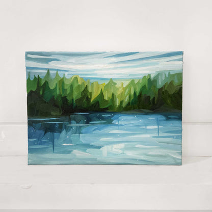 Original oil painting of a peaceful lakeside surrounded by forest.