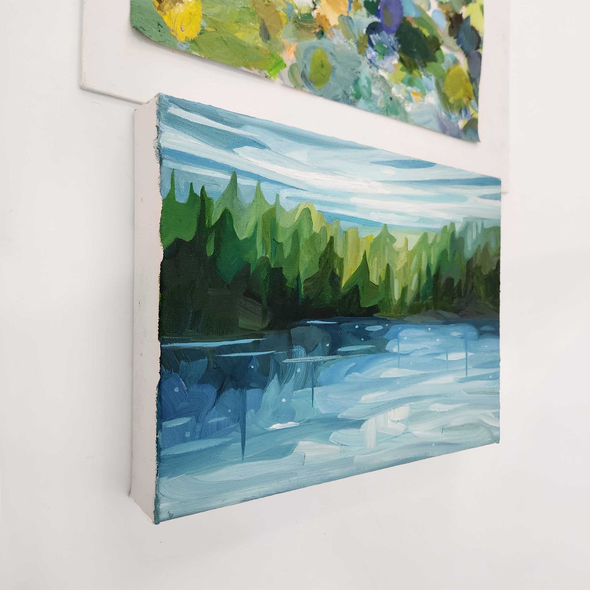 Original oil painting of a peaceful lakeside surrounded by lush forest.
