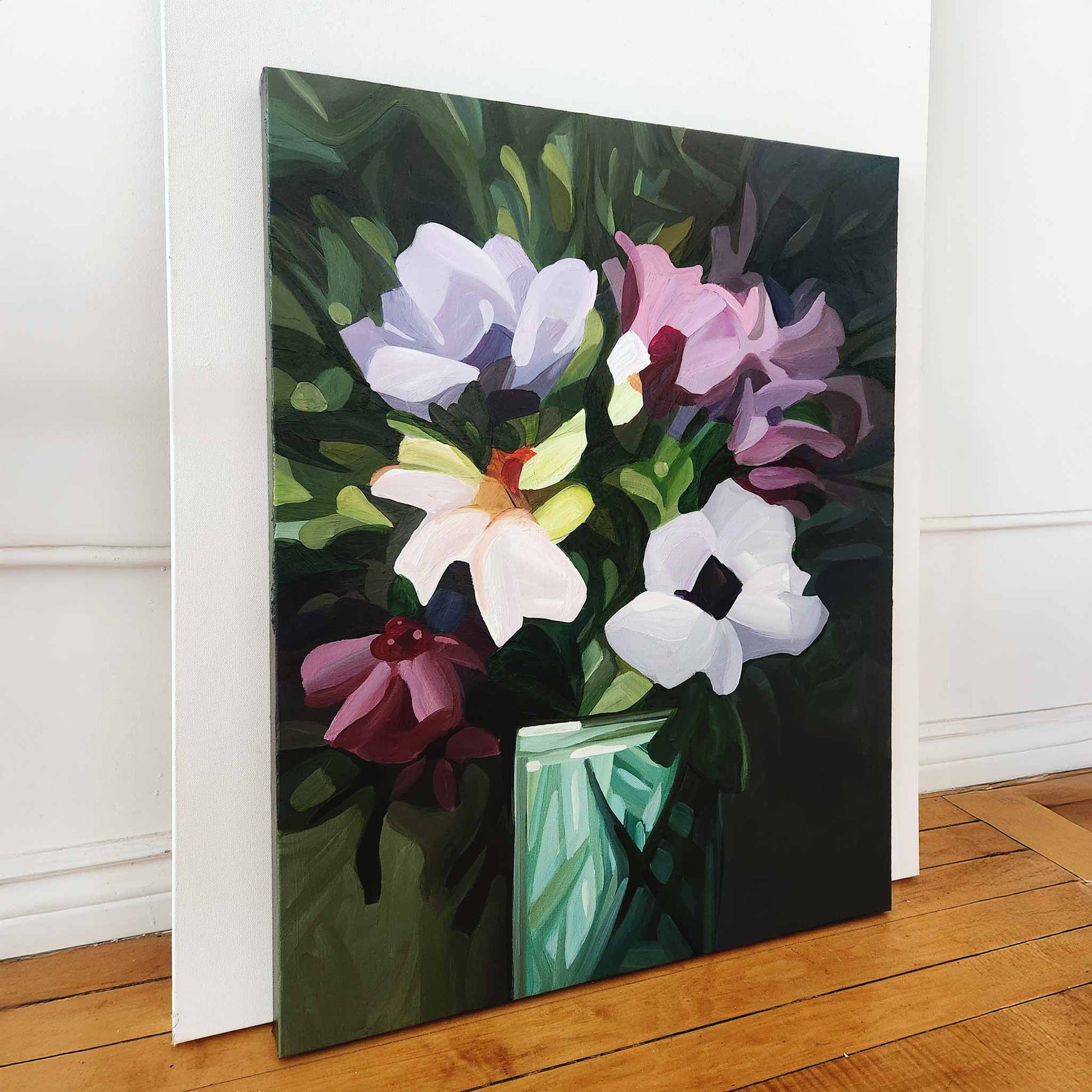 statement floral painting with purple blooms on a green background