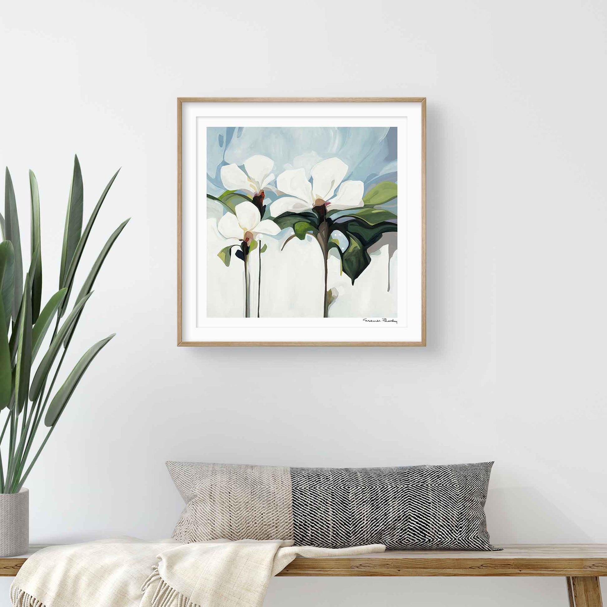 large floral wall art in hallway