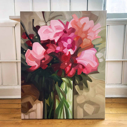 large acrylic wildflower painting with pink and raspberry red blooms on a muted green background