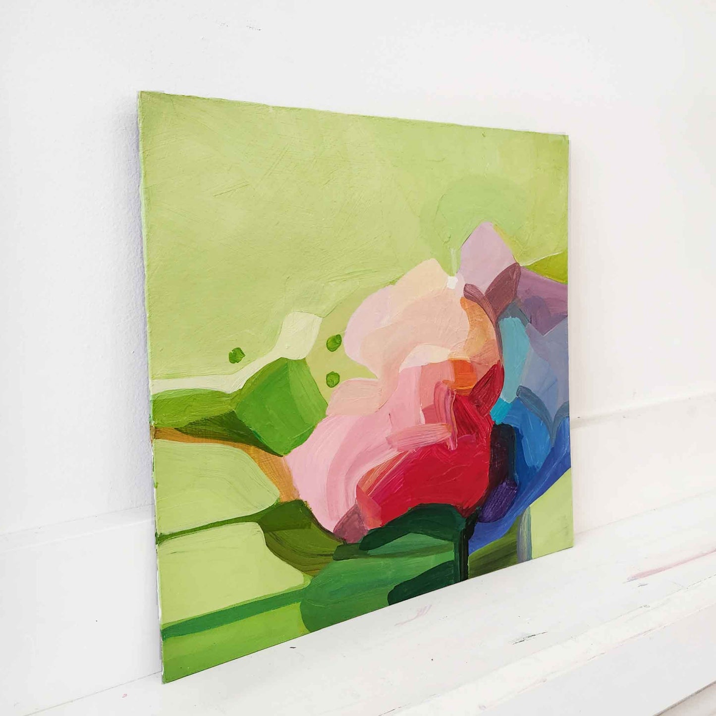 light green abstract painting with pink flower