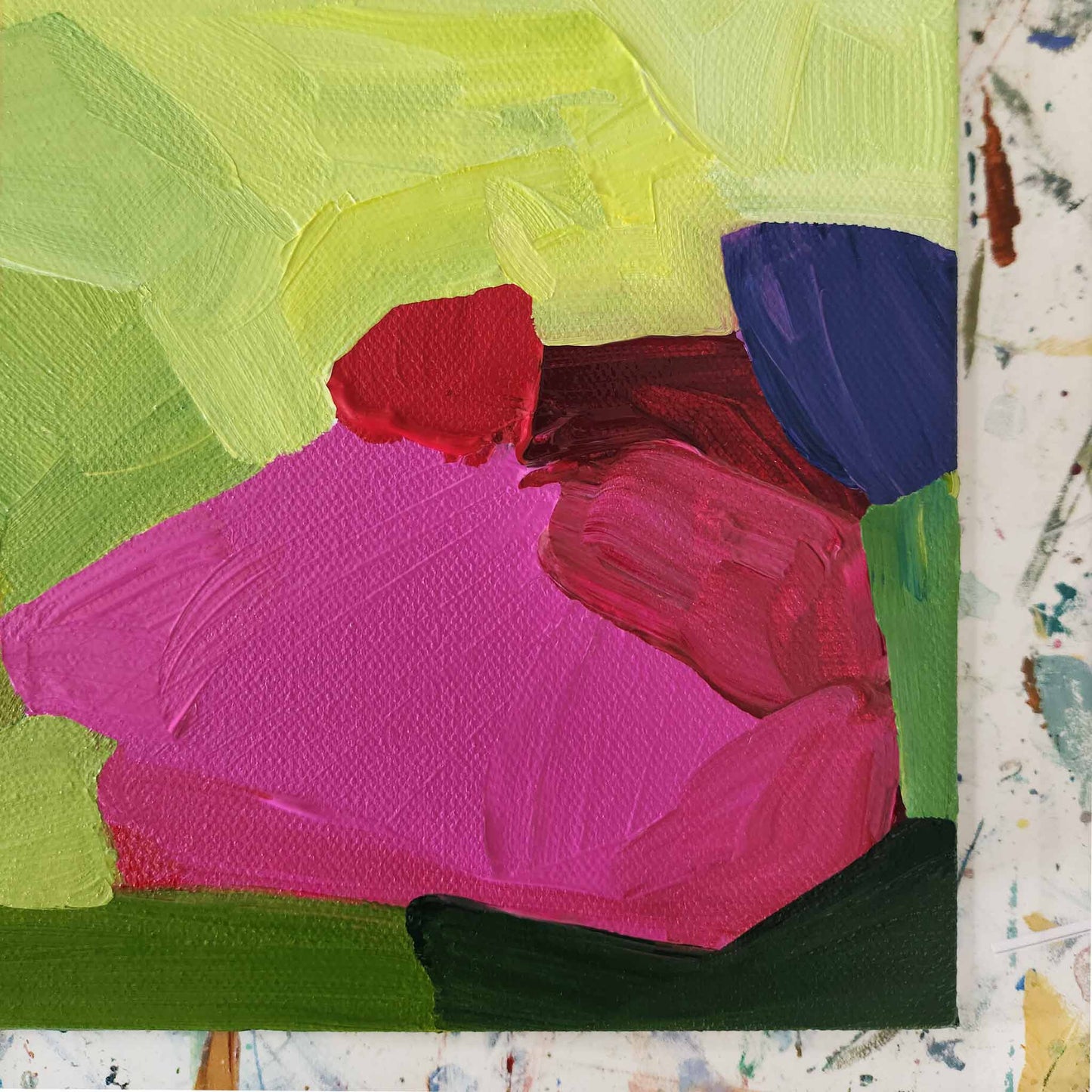 Close up corner view of Canadian abstract artist Susannah Bleasby’s lime green and bright pink small small abstract painting 