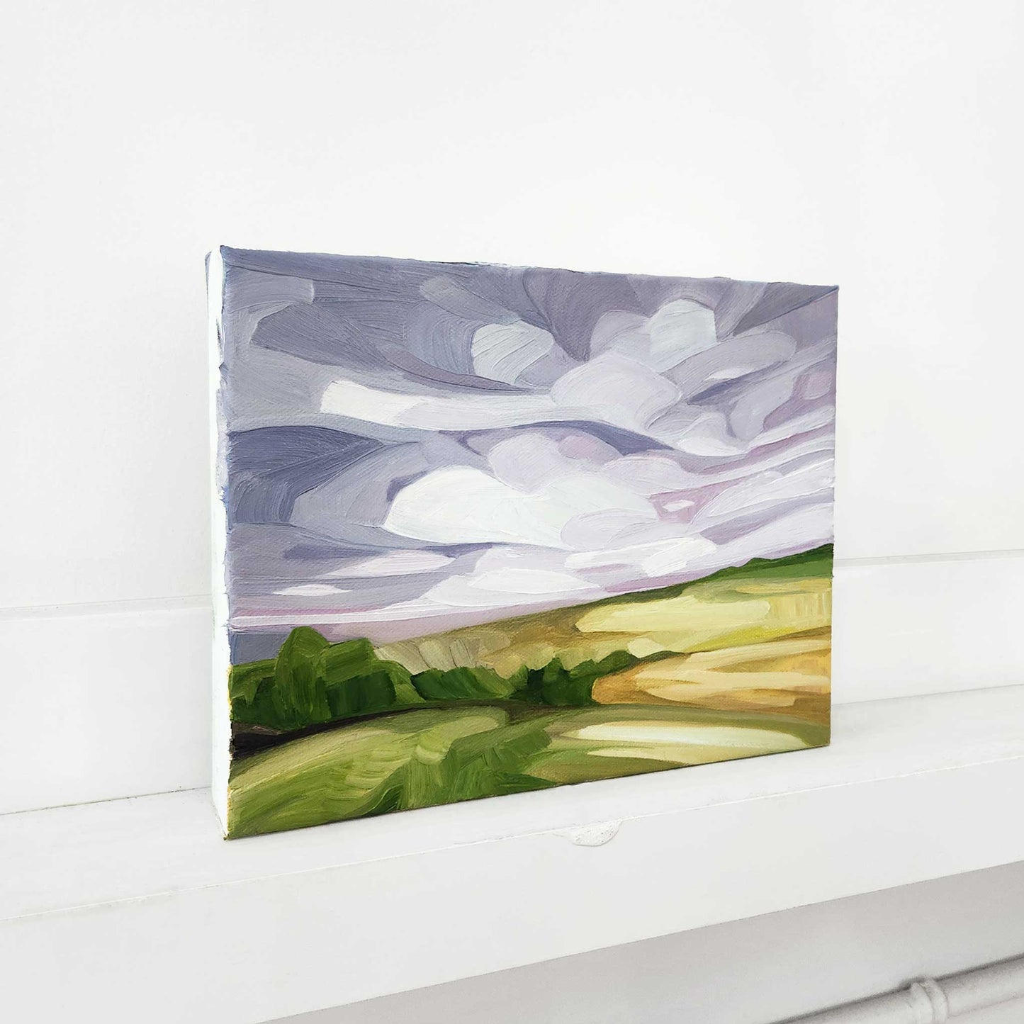 Contemporary abstract landscape featuring mauve skies above rolling fields.