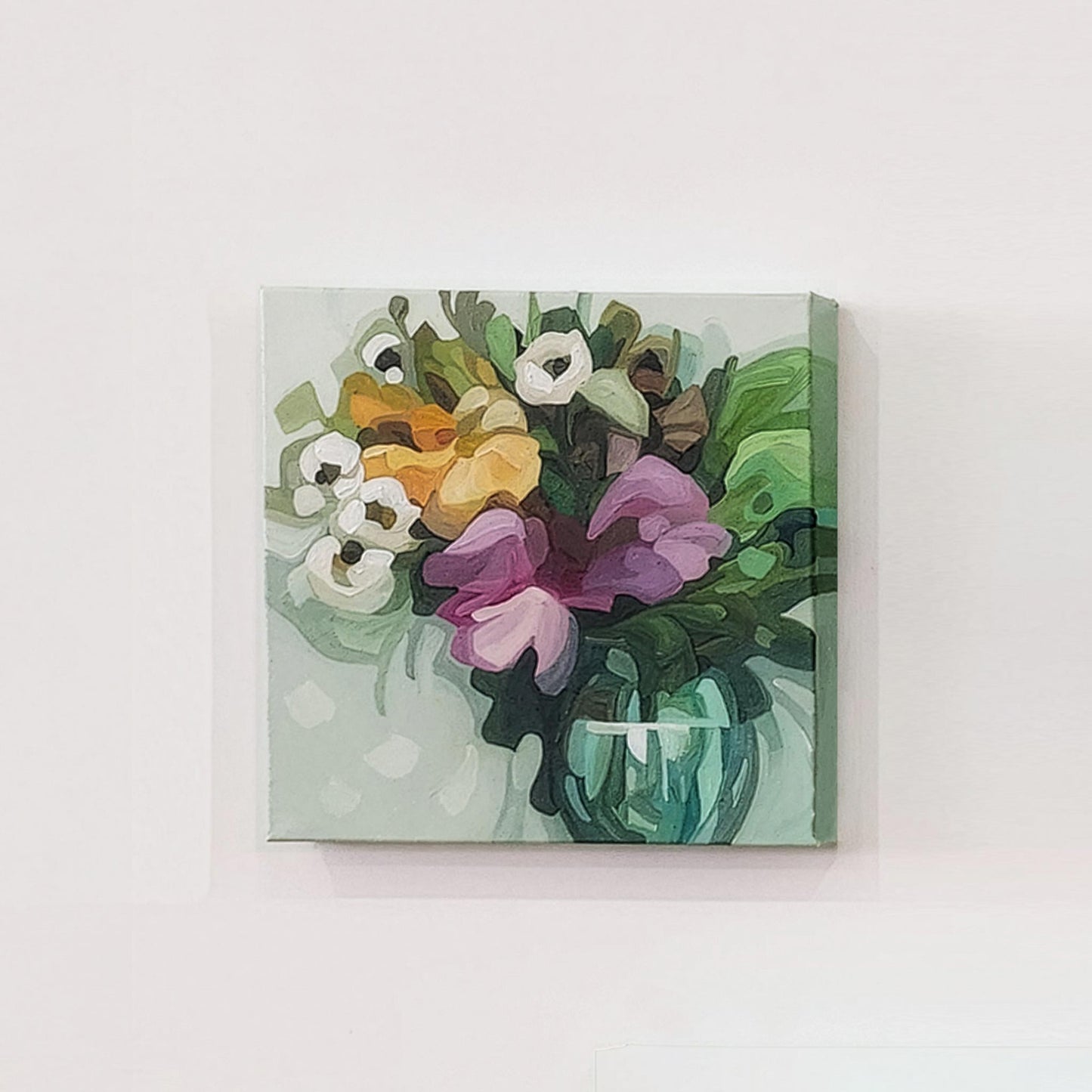 Original floral canvas art featuring colourful flowers on a soft green background
